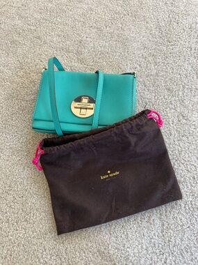 kate spade teal crossbody with silver turn-lock detail and hardware